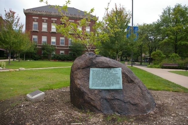 The marker is attached to this boulder, which is located near the university's physics building. Photo by Christopher Busta-Peck, September 27, 2008.