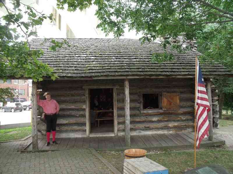 Herman Rueger stands outside the cabin, which was built in 1976.