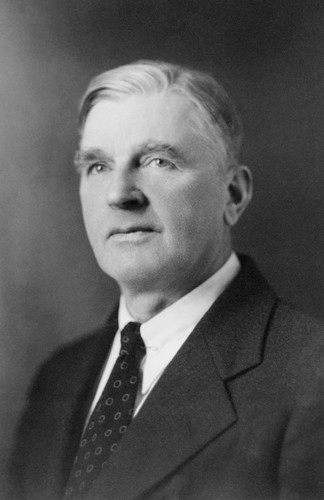 Black and white portrait of man in suit and tie