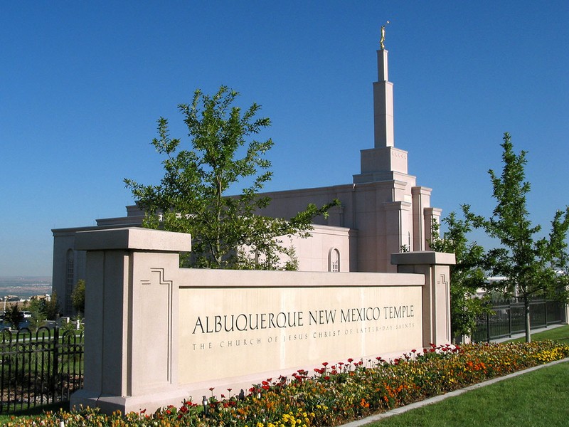 Welcome sign and front view of temple