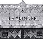 J.A. SKinner's named etched into top of building. 