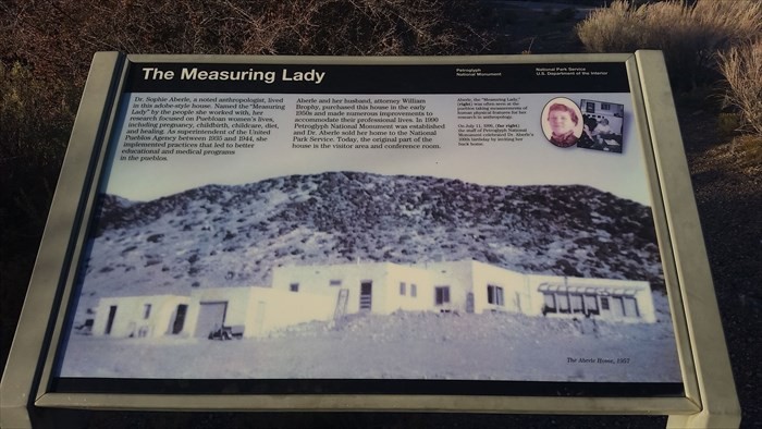 "The Measuring Lady" sign at the Petroglyph National Monument 