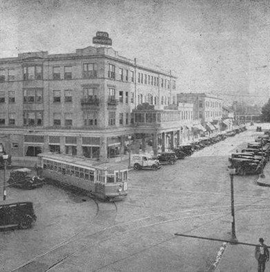 View of the Hotel Huntington with a trolley turning the corner