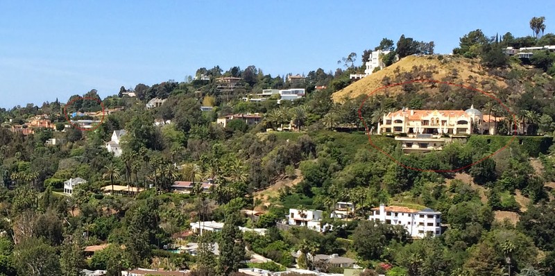 A photograph of the 10050 Cielo Drive mansion before it was demolished. Mansion circled in red. (Publicly available image uploaded to google maps)