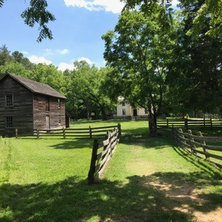The third factory on the left was built to receive and store unmanufactured tobacco. Workers would beat the tobacco very small and then sifting the leaves into bags to be packaged. Today, materials can be seen in the third factory.