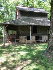 The pack house pictured was used to store cured tobacco until it was ready to be taken to market. While here, leaves would be sorted based quality of the leaf. Size, color, and condition of the leaves were used to determine the grade of each leaf.