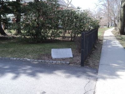 The marker is located just inside this fence