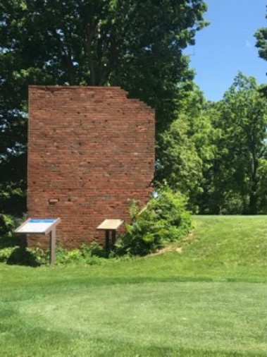 The ruins of the home include several historical markers. 