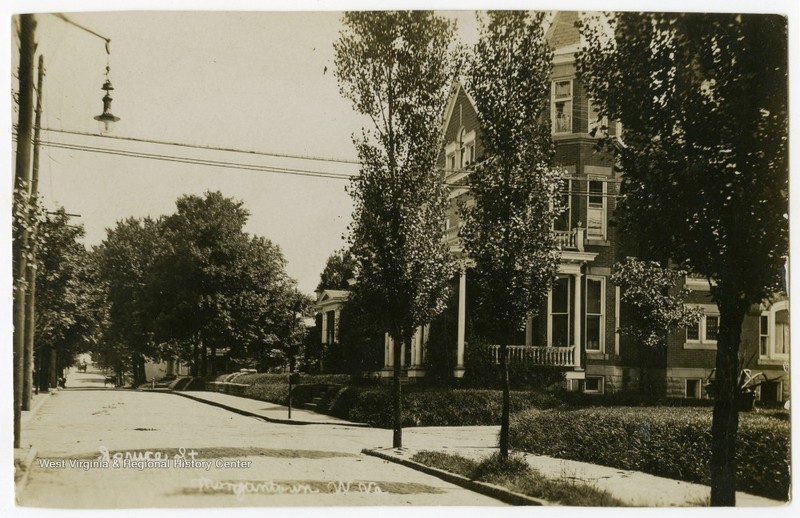 Undated photo of Spruce Street. The Judge Frank Cox House is visible on the right. The photo suggests that Spruce Street was once a more residential road.