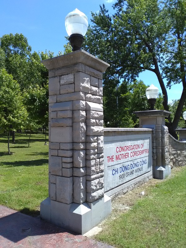 One of 2 entrance columns in front of building donated by Q P Club, a booster group, affiliated with Ozark Wesleyan College. Marian Louisa Powers Winchester, Powers Museum benefactor, was a member of this club when she attended the college.