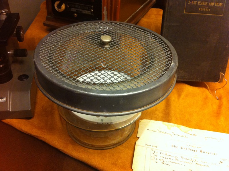 Close-up of one of the diagnostic items in 2017 display. The glass container with wire lid was used to house African frogs used in pregnancy testing.