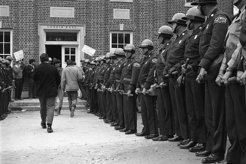 Lenoir Dining Hall during the UNC Foodworkers' Strike of 1969. Students and faculty rallied in support of the foodworkers and their fight for fair labor practices by marching and protesting in front of the entrance to Lenoir.