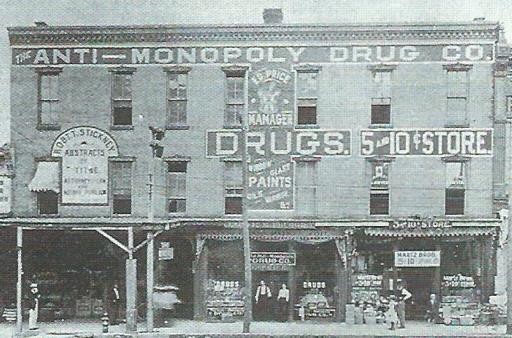 Turn-of-the-20th-century image of the Regan Building with painted signage on the building's facade.