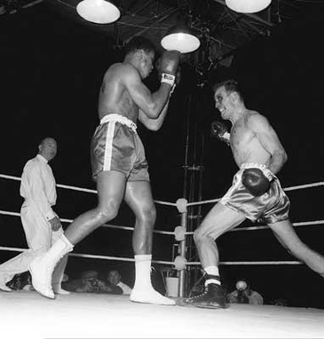 Hunsaker and Ali facing off in their 1960 fight.