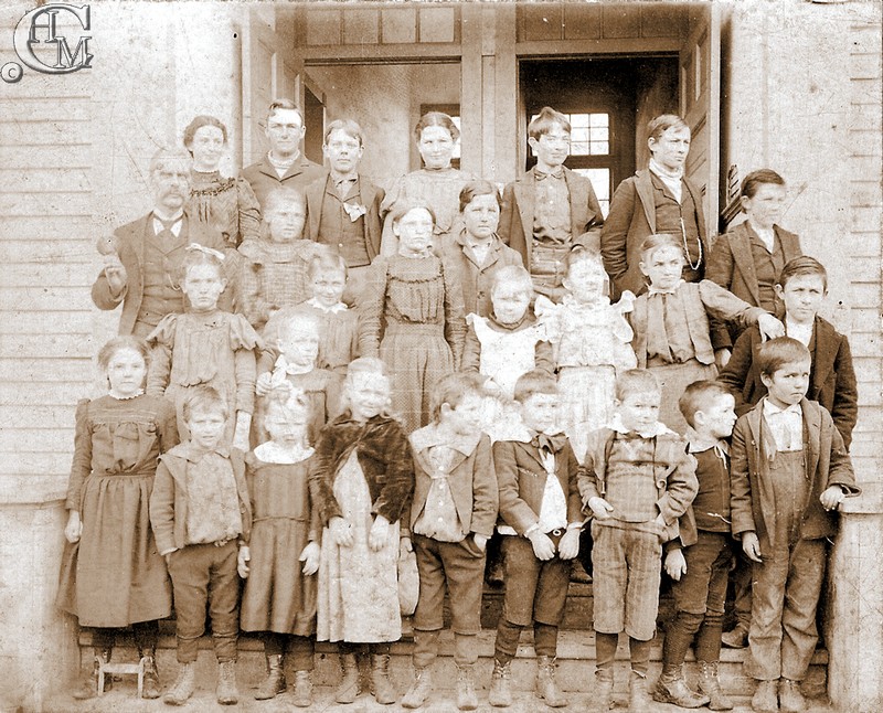 Students and teacher of the first Tyler school at Christmas time 1899.