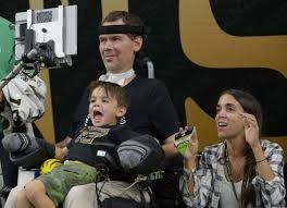 Steve Gleason wheelchair bound with wife and son