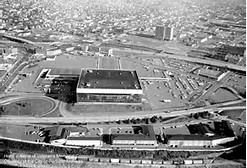 This historic photo of the arena shows a very different view of downtown Portland prior to the construction of numerous downtown buildings and the Moda Center.