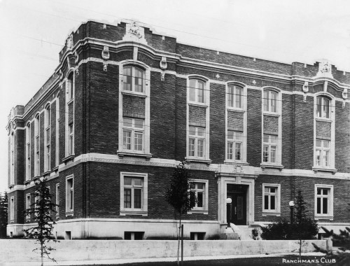 Black and white image of red brick club building