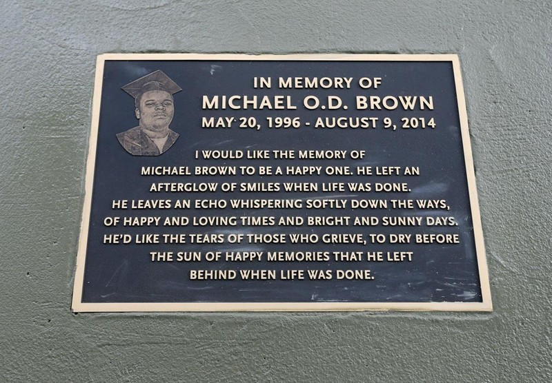 In this photo is the plaque that lies on the sidewalks of Canfield Drive in Ferguson, Missouri. It was written by his family members with the hope that readers understand Michael's importance in life, rather than his importance in death.