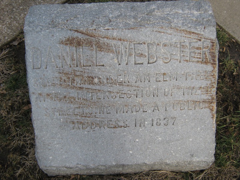 The stone monument, resting on the corner of Webster and Lafayette Ave.