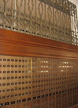 Detail of the PO boxes and ornate wrought iron within the lobby.