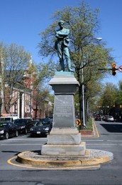 The statue is located in the middle of the intersection of South Washington Street and Prince Street in Old Town.