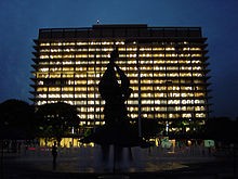 The John Ferraro Building lit up at night time.