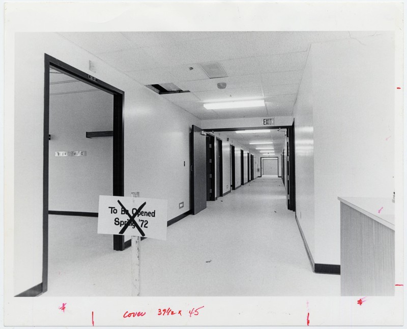 Black and white photograph of a wing of the University of Oregon Medical School, University Hospital South. Sign reads: To be opened Spring '72". Location is directly outside of 5C-27.
