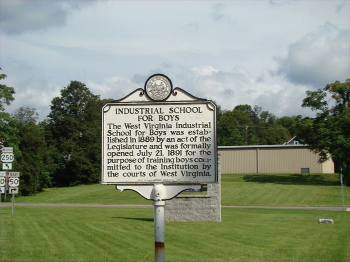 This historical marker for the "Industrial School for Boys" can be found on the premises of the institution.