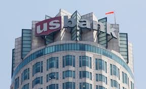 The US Bank sign that adorns the tower's top.