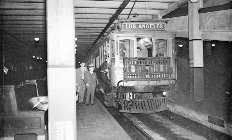 A Black and white shot of a train on the subway. 