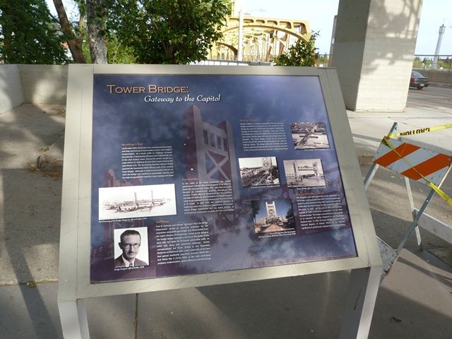Historical information greets pedestrians as they cross the Tower Bridge.