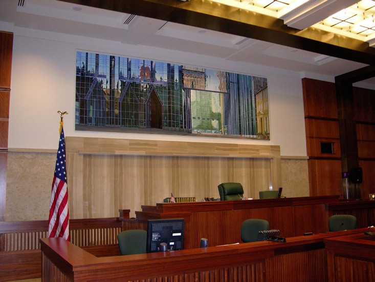 One of the courtrooms with a Brian Shure mural behind the bench.