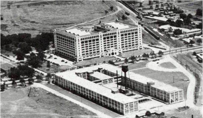 1928 aerial photo of the newly-completed Montgomery Ward Building on West 7th Street with remnants of the driving park in the background.