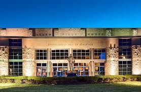 A statue of Forrest "Phog" Allen stands outside the entrance to the Booth Hall of Athletics at Allen Fieldhouse.