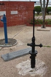 The two wells, the blue one marks the location of the water water well, and the Black the location of the first successful oil well.