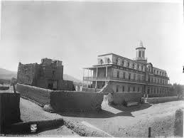 Circa 1881 photo of San Miguel Mission (left) and St. Michael's Dormitory. This photo gives a great idea of what the dorm looked like as originally constructed. Photo by W.H. Jackson and Co. Courtesy of the Palace of the Governors photo archives