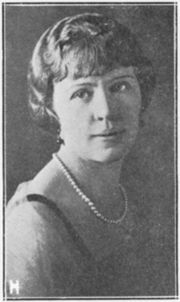 Black and white portrait of woman wearing pearl necklace