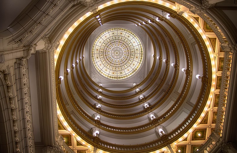 A vertical view of the building's central, 150-foot rotunda with stained-glass cap.