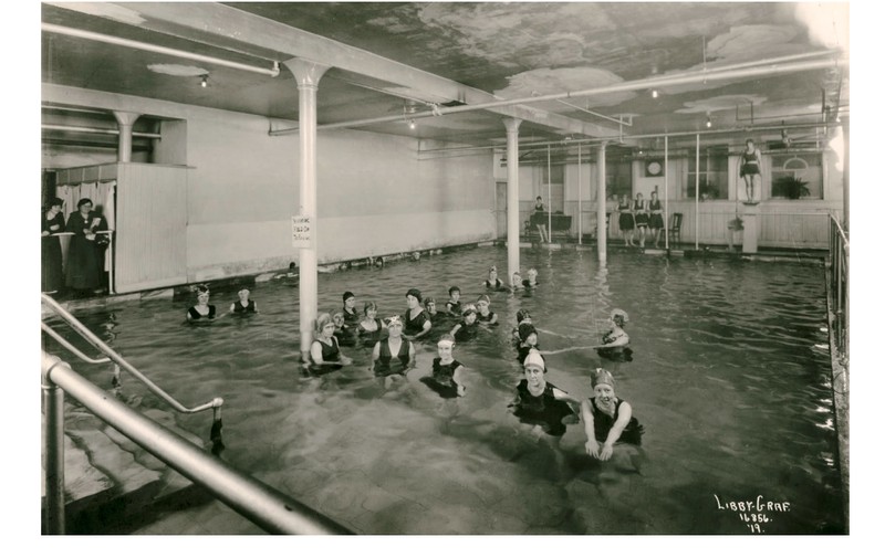 1919: Women in swimming pool (likely YWCA meeting) at original four-story Ridpath Hotel. 