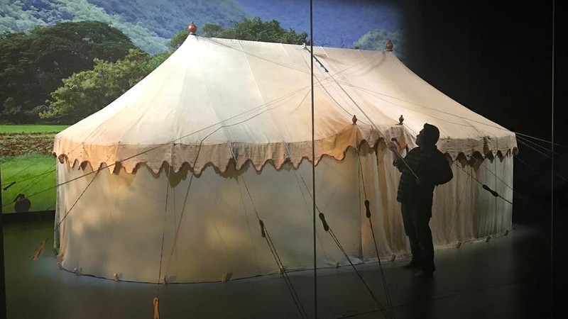 A curator tends to George Washington's original headquarters tent that is part of a larger exhibit within the museum.  