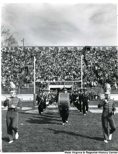 The Pride of West Virginia marches onto the field, ca. 1960-75.