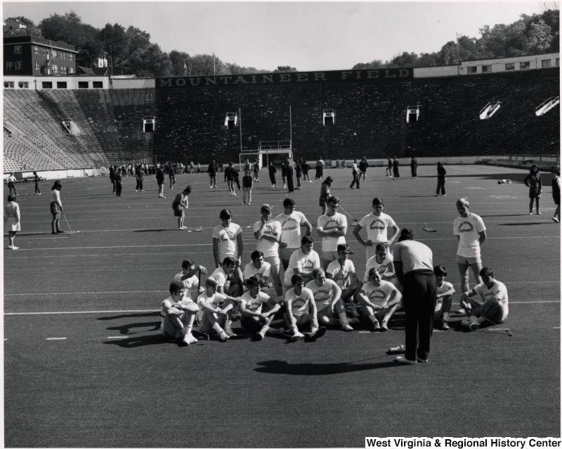 Physical education students practice golf on Mountaineer Field, ca. 1965-71.