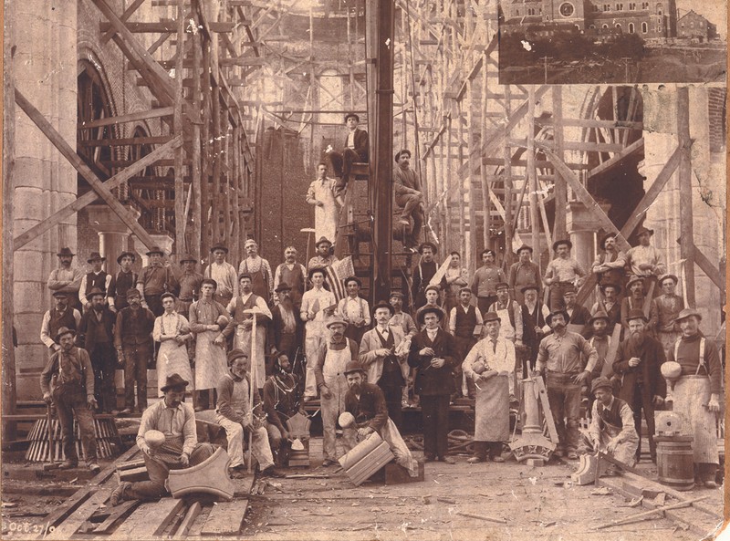 The "Basilica Builders" pictured in October 1896, holding the tool of their trade. 