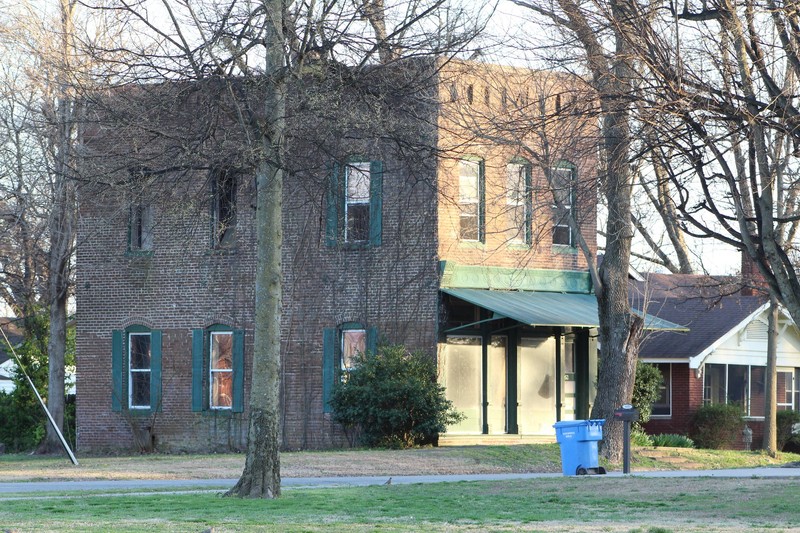 A view of the north wall showing the second floor burnt out windows.