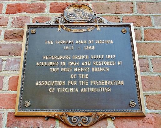 Plaque commemorating the history and preservation of Historic Farmers Bank.