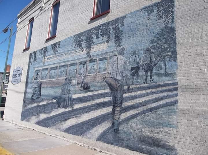 Scene above re-created as a mural on the west side of building at 140 West Third Street. Artist was John Biggs who also did murals on Burlingame and Chaffee Opera House and Pollard Building #1 (See Clio entries for both).
