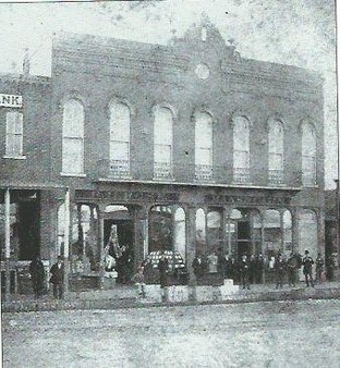 Burlingame and Chaffee Opera House building showing two storefronts on the first floor, circa 1878-80. 