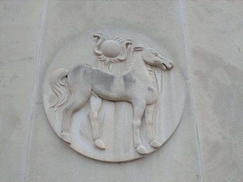 One of several stone sculptures on the West Fourth Street side of the former Bank of Carthage building.