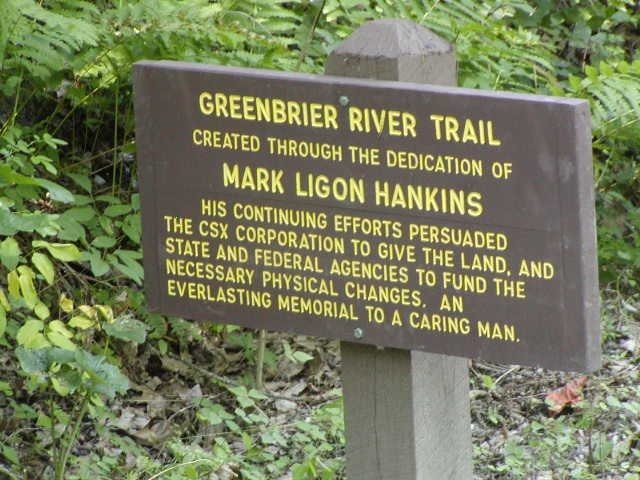 A sign along the Greenbrier River Trail tells of the efforts of Mark Ligon Hankins towards the establishment of the trail. Courtesy of J. Watson.5
